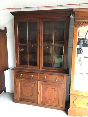 Lot 134 - Good quality Edwardian mahogany two-height bookcase with moulded dentil cornice, the interior with wooden shelves enclosed by bevelled astragal glazed doors with two drawers and panelled cupboards...