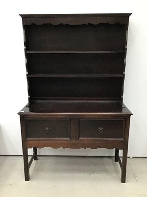 Lot 165 - Oak finished two height dresser with plate rack above and cupboards below on square chamfered legs
