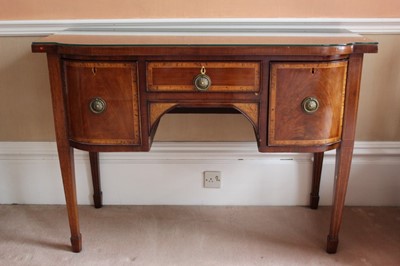 Lot 924 - George III mahogany bowfront sideboard with crossbanded top above two deep drawers flanking a central drawer, on square taper legs terminating on spade feet, 120cm wide x 51cm deep x 86cm high