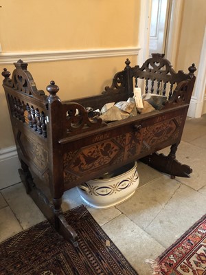 Lot 921 - Early 19th century Continental inlaid mahogany rocking crib with ornate marquetry panels depicting cherubs, birds and flora, inscribed Anno 1830, with liner to base, ideal as a log store or planter...