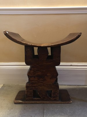 Lot 922 - Antique African Tribal seat with carved stylised turtle supports and dished seat, on rectangular base, 59.5cm wide x 38cm deep x 67cm high
