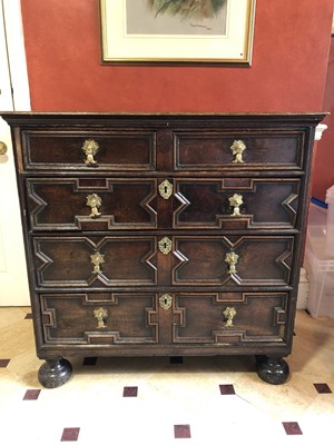 Lot 916 - Late 17th century oak geometric chest of two short and three long drawers with brass drop handles, on turned and bun feet, 96cm wide x 96cm high x 54cm deep