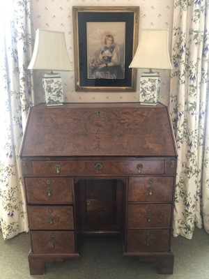 Lot 928 - 18th century and later walnut kneehole bureau, the fall flap enclosing a fitted interior, above one long drawer and six small drawers flanking the recessed cupboard, on bracket feet, 85.5cm wide x...