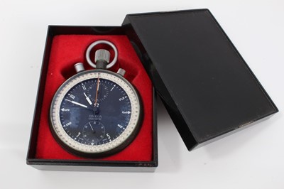 Lot 361 - Rare 1960s Omega Olympic timekeeper's stopwatch with twelve hour dial, subsidiary seconds, minutes and split seconds, in circular case with matte green textured finish. 65mm diameter, with Omega bo...