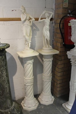 Lot 803 - Two similar Classical style reconstituted alabaster figures on torchere stands.