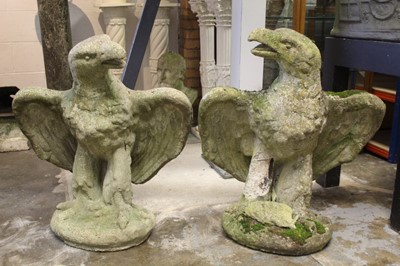Lot 835 - Pair of composition concrete statues of eagles