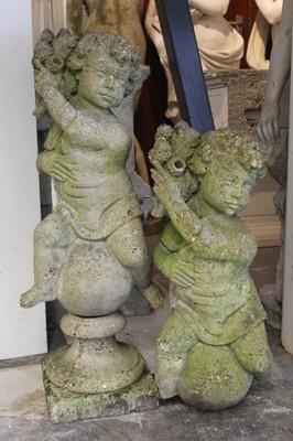 Lot 841 - Pair of concrete putto figures