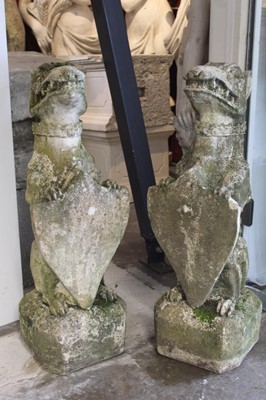 Lot 837 - Pair of reconstituted stone figures of heraldic beasts