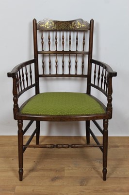 Lot 713 - Regency rosewood and brass inlaid spindle back elbow chair