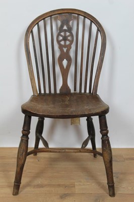 Lot 714 - 19th century yew and elm wheelback chair