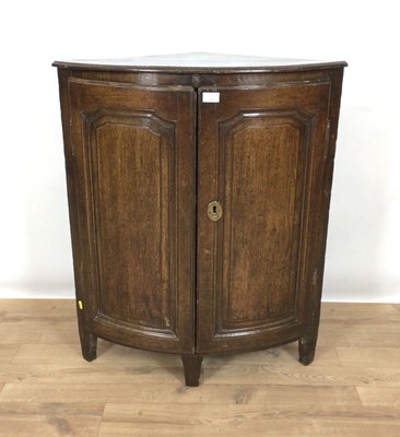 Lot 717 - 18th century Continental oak floor standing bowfront corner cupboard