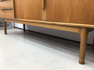 Lot 187 - Mid 20th century Teak sideboard with three drawers and two doors bearing label A.H McIntosh & Co Ltd