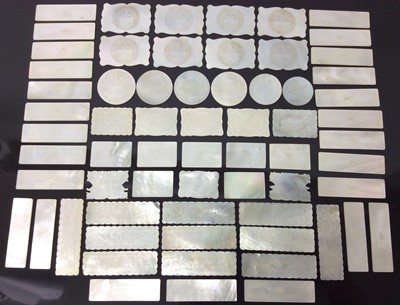 Lot 470 - Large collection of 18th / 19th century Chinese mother of pearl gaming counters, including various shapes, the longest approximately 6cm, examples with engraved armorial, initials etc. (Approximate...