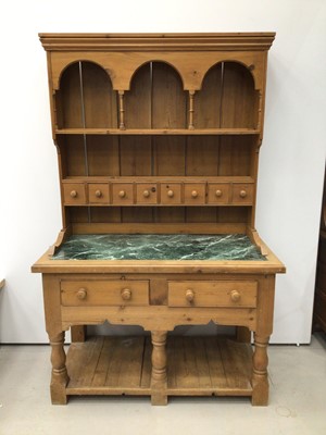 Lot 188 - Victorian style pine two-height dresser, the plate rack with  arcaded frieze, 8 spice drawers, the base with green marble top, two drawers and pot board below with turned supports. 135cm wide x 208...