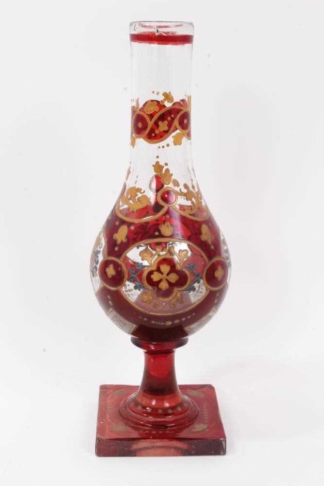 Lot 47 - Bohemian glass hookah base, decorated with gilt foliate patterns on a red ground, 29.5cm height