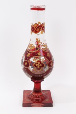 Lot 47 - Bohemian glass hookah base, decorated with gilt foliate patterns on a red ground, 29.5cm height