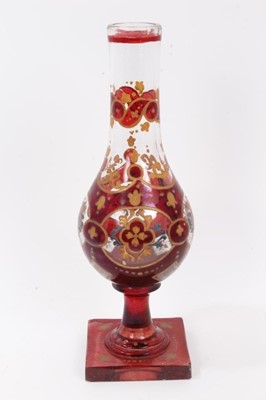 Lot 47 - Bohemian glass hookah base, decorated with gilt foliate patterns on a red ground, 29.5cm height
