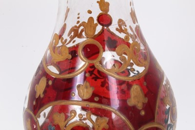 Lot 47 - Bohemian glass hookah base, decorated with gilt foliate patterns on a red ground, 29.5cm height