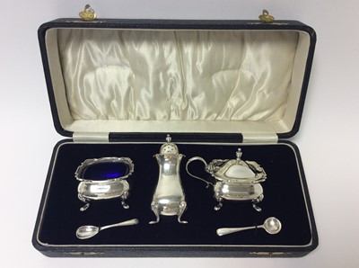 Lot 154 - George V Silver three piece cruet set of cauldron form on pad feet, the salt and mustard with removable blue glass liners, (Birmingham 1925) maker William Suckling Ltd, together with associated sil...
