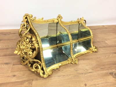 Lot 799 - Victorian gilt gesso three tier hanging corner shelf