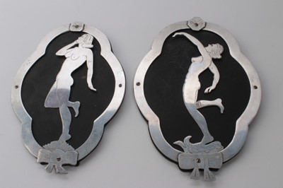 Lot 629 - Pair of Second World War Trench Art Cut aluminium plaques depicting glamour girls (2)