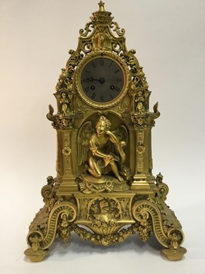 Lot 527 - Good quality French Charles X ormolu mantle clock with ornate cast cherubs , lion mask and knights helm decoration , French 8 day movement striking on bell with silk suspension pendulum and outside...