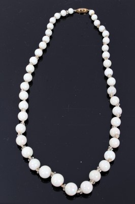 Lot 310 - Opal bead necklace with a string of graduated spherical opal beads measuring approximately 5.8mm to 9.6mm diameter with faceted glass spacers on 9ct gold clasp. Length approximately 49cm
