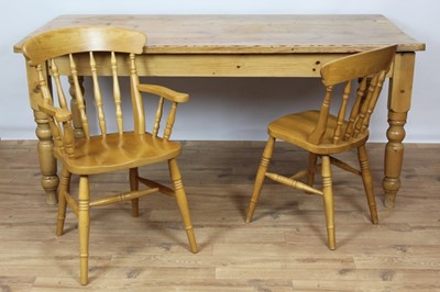 Lot 825 - Pine kitchen table and ensuite set of eight country chairs, including a pair of carvers