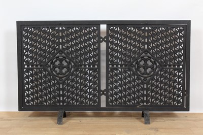 Lot 823 - Unusual metal fire screen, utilising man hole covers