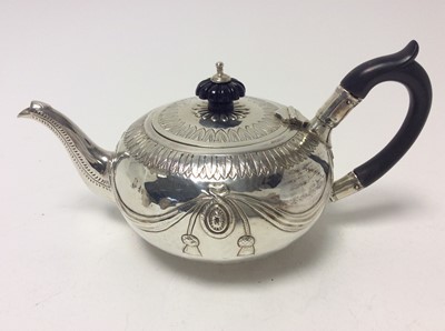 Lot 186 - Victorian silver bachelors teapot of bullet form, with engraved acanthus leaf borders, embossed ribbon and swag decoration, hinged cover with fluted ebony finial and ebony loop handle, on circular...