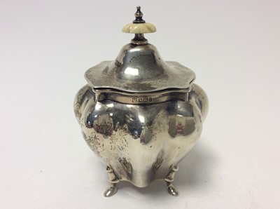 Lot 189 - Edwardian silver tea caddy of bombe form, domed hinged cover with ivory finial, raised on four hoof feet, approximately 8oz, 13cm in height