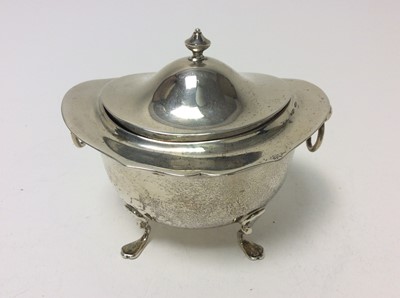 Lot 191 - Edwardian silver tea caddy of oval form with twin ring handles, and domed hinged cover, raised on four hoof feet, (Birmingham 1904), makers mark rubbed, at approximately 7oz, 11cm in width