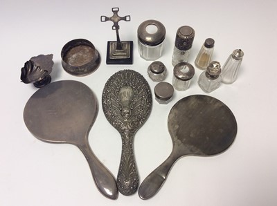 Lot 193 - Late Victorian silver hand mirror with ornate embossed floral and scroll decoration (Birmingham 1900), together with two other silver hand mirrors and various silver mounted cut glass dressing tabl...
