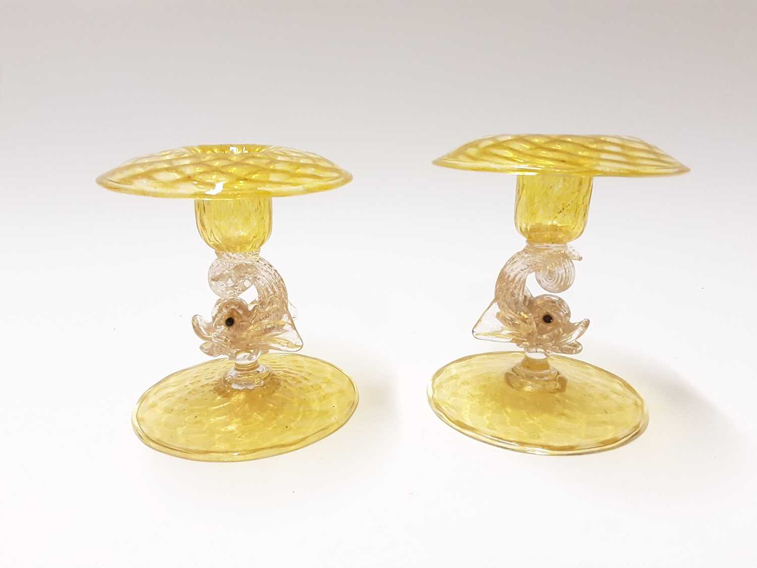Lot 366 - Two good quality Murano Venitian yellow glass dolphin candlesticks