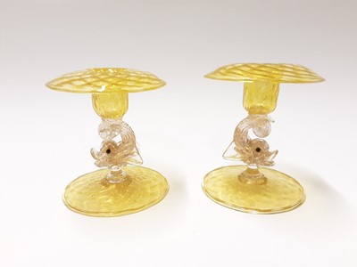 Lot 213 - Two good quality Murano Venitian yellow glass dolphin candlesticks