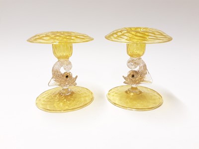 Lot 366 - Two good quality Murano Venitian yellow glass dolphin candlesticks
