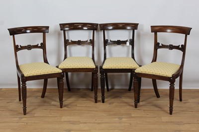 Lot 969 - Set of four Regency mahogany dining chairs with bar backs and carved rail, loose drop-in seats on carved and turned front supports with rear sabre legs