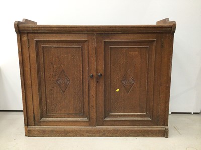 Lot 57 - Late Victorian oak cupboard with two panelled doors