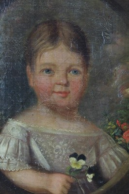 Lot 639 - Victorian English School oil on canvas - portrait of a child clutching pansies painted in an oval, in walnut veneered frame, 42cm x 32cm