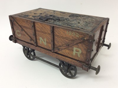 Lot 435 - Early 20th century novelty oak desk cigar box, in the form of a four wheel British Rail coal truck with GNR livery, with concealed hinged top (locked and key missing), 34cm long stamped registratio...