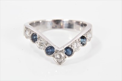 Lot 285 - Sapphire and diamond wish-bone ring with five brilliant cut diamonds alternating with four round mixed cut blue sapphires in 18ct white gold setting, ring size Q.