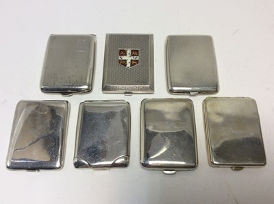 Lot 147 - George V silver match book cover of rectangular form, with enamelled crest to cover and overall engine turned decoration (Birmingham 1920), together with six other silver match book covers (various...