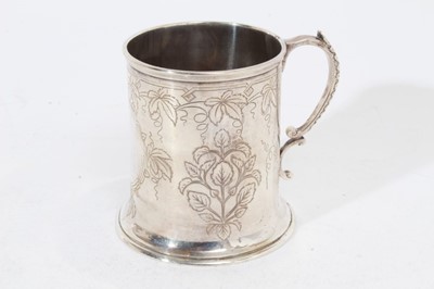 Lot 252 - Victorian silver Christening mug of cylindrical form with engraved foliate decoration, and scroll handle, (London 1868), maker S.S, at approximately 8oz, 8.5cm in overall height