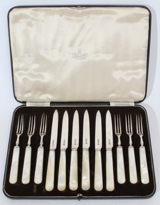 Lot 266 - Set of six George VI silver fruit knives and forks with Mother of Pearl handles, (Sheffield 1938), maker Mappin & Webb in velvet lined fitted case, knives each 17cm in length