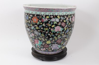 Lot 132 - Large Chinese famille noire fishbowl, on wooden stand