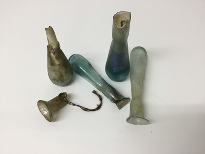 Lot 512 - Four Roman glass tear bottles, including iridescent blue, the largest 9.25cm length