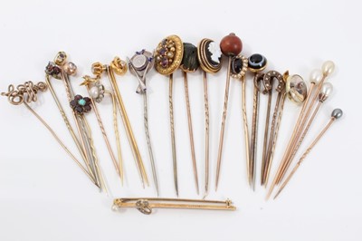 Lot 337 - Collection of approximately 25 antique stick pins to include an Edwardian pearl and diamond cluster stick pin, a Regency/early Victorian garnet and turquoise flower stick pin, diamond and gem-set s...