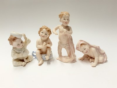 Lot 91 - Five Royal Doulton figures - Santa's Helper HN3301, First Steps HN3361, What Fun HN3364, Peek-A-Boo HN3363 and Well Done HN3362, plus Royal Doulton Tweedle Dee and Tweedle Dum salt and pepper pots...