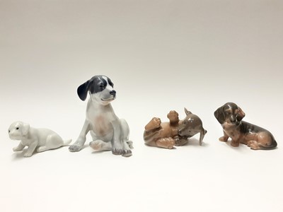 Lot 155 - Four Royal Copenhagen porcelain dogs, model numbers 206, 1408, 3140 and 1311