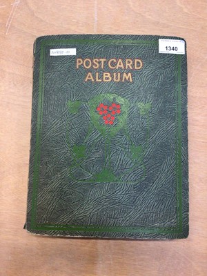 Lot 1412 - Early 20th century postcard album containing postcards, Christmas cards, and birthday cards